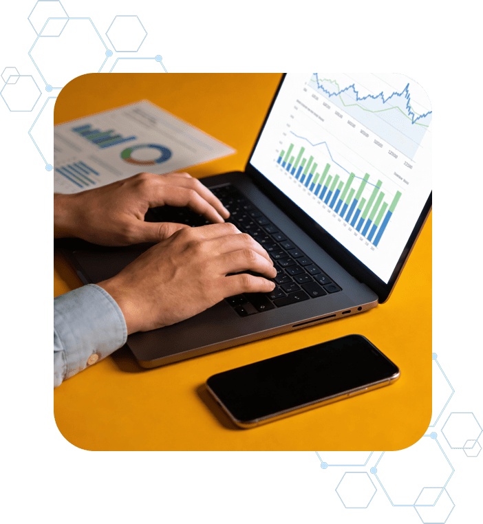 Business professional analyzing performance charts on a laptop, symbolizing enterprise technology consulting and digital transformation services.